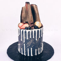 Chocolate Coated Cake with Chocolate Drips, Berries, Chocolate Sheets and Ferrero